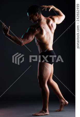 Athlete, flexing or back muscle for fitness goals, workout or training wellness check. Bodybuilder, sports man or muscular model body on aesthetic backdrop or black studio background for art deco Athlete, flexing or back muscle for fitness goals, workout or training wellness check. Bodybuilder, sports man or muscular model body on aesthetic backdrop or black studio background for art deco 142682499