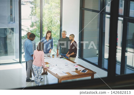 People, architect and blueprint with team in meeting for planning, brainstorming or civil engineering at office. Group or contractors with documents or discussion on construction project at workplace People, architect and blueprint with team in meeting for planning, brainstorming or civil engineering at office. Group or contractors with documents or discussion on construction project at workplace 142682813
