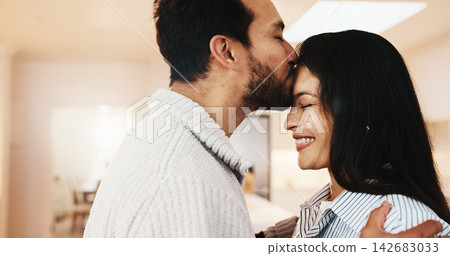 Forehead, kiss and happy couple in home, trust and bonding with partner on break or marriage loyalty. People, love and connection with spouse, relationship commitment and relax with smile on weekend Forehead, kiss and happy couple in home, trust and bonding with partner on break or marriage loyalty. People, love and connection with spouse, relationship commitment and relax with smile on weekend 142683033