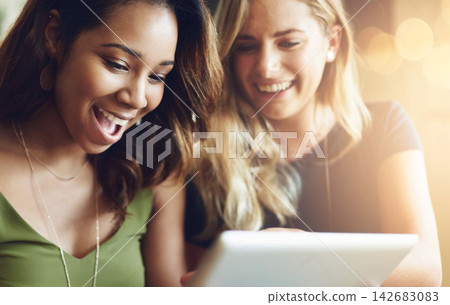 Laugh, friends and women in coffee shop with tablet for social media, funny meme or networking together. Communication, smile and girl in cafe with online post, happiness or connection on digital app Laugh, friends and women in coffee shop with tablet for social media, funny meme or networking together. Communication, smile and girl in cafe with online post, happiness or connection on digital app 142683083