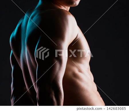 Man, body and fitness flex in studio for wellness or bodybuilder, strong and dark for power or strength. Person, six pack and stomach with muscle, isolated and black background for aesthetic shadow. Man, body and fitness flex in studio for wellness or bodybuilder, strong and dark for power or strength. Person, six pack and stomach with muscle, isolated and black background for aesthetic shadow. 142683085
