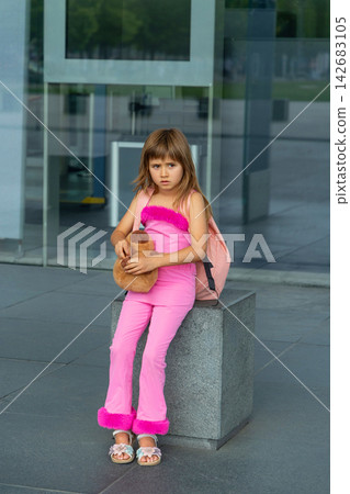 Little girl going on holiday with suitcases at airport Little girl going on holiday with suitcases at airport 142683105