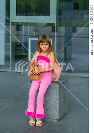 Little girl going on holiday with suitcases at airport Little girl going on holiday with suitcases at airport 142683106