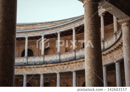 Palace of charles v circular courtyard showing renaissance architecture with stone columns, arches, and ornate detailing 142683557