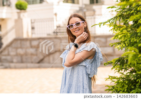 Long-haired beautiful woman on the nice maison background Long-haired beautiful woman on the nice maison background 142683603