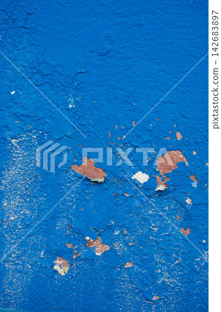 Weathered blue wall with peeling paint texture and rustic surface detail Weathered blue wall with peeling paint texture and rustic surface detail 142683897