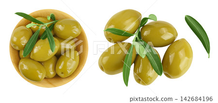 Green olives with leaves in wooden bowl isolated on a white background with full depth of field. Top view. Flat lay Green olives with leaves in wooden bowl isolated on a white background with full depth of field. Top view. Flat lay 142684196