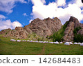Rocky mountains and yurts at Bubeit Camp, Mongolia 142684483