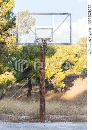 Outdoor Basketball Hoop in Sunny Park Landscape Outdoor Basketball Hoop in Sunny Park Landscape 142685985
