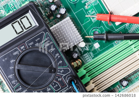 Electronics Testing with Multimeter on Circuit Board Electronics Testing with Multimeter on Circuit Board 142686018