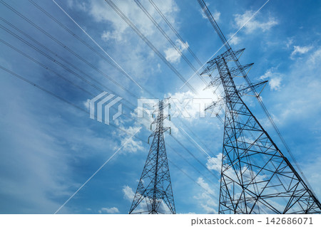 Power Transmission Towers and High Voltage Lines Under Blue Sky Power Transmission Towers and High Voltage Lines Under Blue Sky 142686071