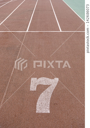 Running Track Lane Seven with White Lines on Outdoor Sports Surface Running Track Lane Seven with White Lines on Outdoor Sports Surface 142686073