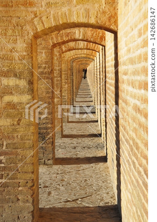 Isfahan, Iran, the corridor of the 33-arch bridge (Si-o-Seh Bridge), Zayandeh River. Isfahan, Iran, the corridor of the 33-arch bridge (Si-o-Seh Bridge), Zayandeh River. 142686147