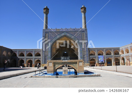 Iran, Isfahan, Friday Mosque, Jameh Mosque, iwan and minaret decorated with tiles 142686167