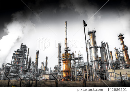 Industrial Oil Refinery with Smokestacks and Heavy Smoke Industrial Oil Refinery with Smokestacks and Heavy Smoke 142686201