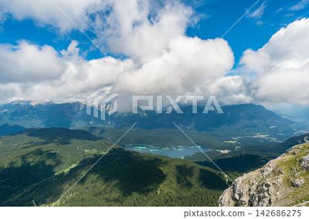 Mountain Lake Panorama with Forest Valley and Dramatic Clouds 142686275