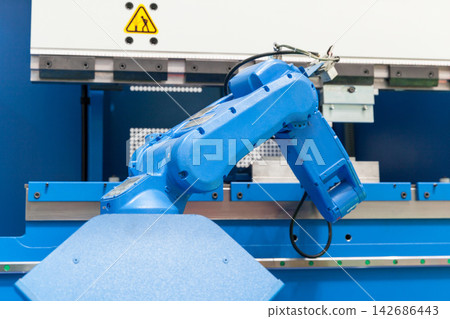 Industrial Robot Arm Operating Automated Factory Machine Industrial Robot Arm Operating Automated Factory Machine 142686443