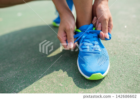 Running Shoe Laces Tied Before Outdoor Workout Running Shoe Laces Tied Before Outdoor Workout 142686602