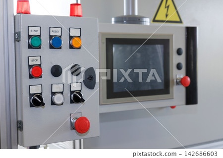 Industrial Control Panel with Emergency Stop Buttons and HMI Screen Industrial Control Panel with Emergency Stop Buttons and HMI Screen 142686603