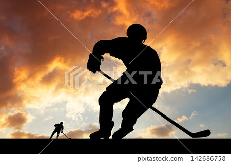 Ice Hockey Player Silhouette at Sunset Sky 142686758
