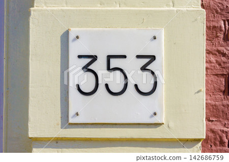 House Number 353 on White Address Plaque and Brick Wall House Number 353 on White Address Plaque and Brick Wall 142686759