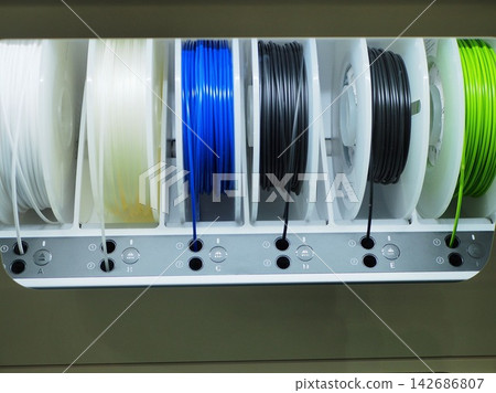 3D Printer Filament Spools in Colorful Storage Cabinet 3D Printer Filament Spools in Colorful Storage Cabinet 142686807