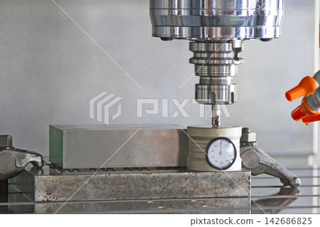 CNC Milling Machine Drilling Metal Block in Precision Workshop CNC Milling Machine Drilling Metal Block in Precision Workshop 142686825