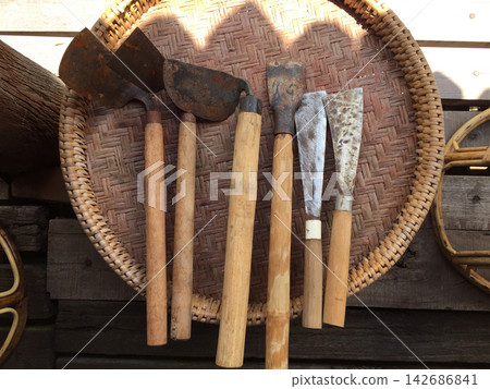 Rustic Garden Tools on Woven Bamboo Tray Rustic Garden Tools on Woven Bamboo Tray 142686841