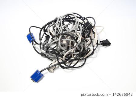 Tangled Computer Cables and VGA Connectors on White Background 142686842