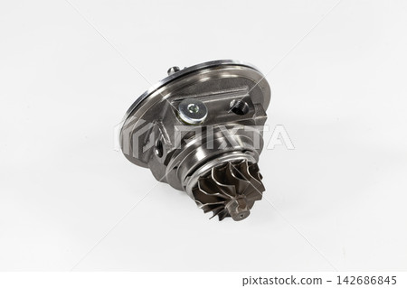 Turbocharger Cartridge Metal Engine Part Isolated on White Turbocharger Cartridge Metal Engine Part Isolated on White 142686845