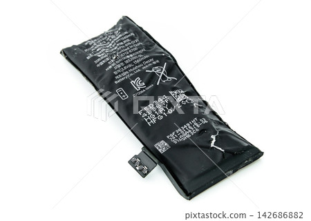 Damaged Swollen Smartphone Battery Isolated on White Background Damaged Swollen Smartphone Battery Isolated on White Background 142686882