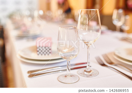 Elegant Empty Wine Glasses on Fine Dining Restaurant Table Elegant Empty Wine Glasses on Fine Dining Restaurant Table 142686955