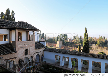 A view of the Courtyard of the Generalife, adjacent to the Alhambra Palace, a UNESCO World Heritage Site in Granada, Spain. A view of the Courtyard of the Generalife, adjacent to the Alhambra Palace, a UNESCO World Heritage Site in Granada, Spain. 142687105