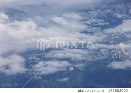 Aerial cloudscape over mountain range landscape Aerial cloudscape over mountain range landscape 142688663
