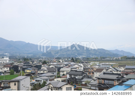April 27 2026 Morioka rural village with houses farmland and distant mountain range April 27 2026 Morioka rural village with houses farmland and distant mountain range 142688995