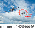 Commercial Airplane Flying Past Warning Graphic of Unauthorized Drone Detected Near Airport Airspace. 142690046