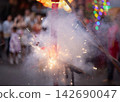 Exploding Chinese Firecrackers with Smoke and Sparks during Lunar New Year Celebration in Old Chinatown Street. 142690047