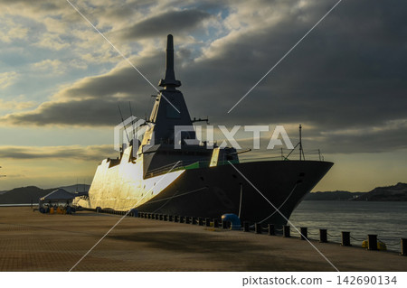 A Japan Maritime Self-Defense Force destroyer illuminated by the morning sun. A Japan Maritime Self-Defense Force destroyer illuminated by the morning sun. 142690134