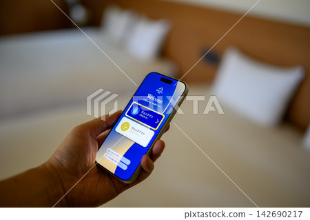 Smartphone screen showing check-in via hotel app Smartphone screen showing check-in via hotel app 142690217