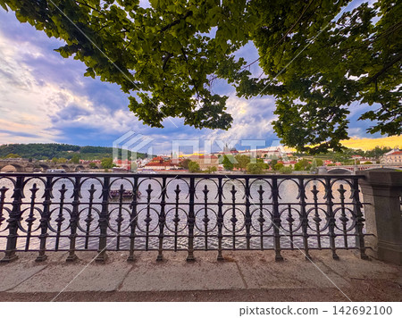 View of Prague Castle and Vltava River from a park during sunset View of Prague Castle and Vltava River from a park during sunset 142692100