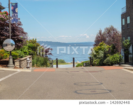 Waterfront street view leading to the sea in Ruston, WA - June 13, 2026 Ruston WA, USA Waterfront street view leading to the sea in Ruston, WA - June 13, 2026 Ruston WA, USA 142692448