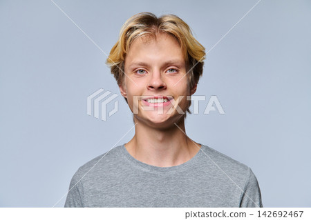 Close up portrait of smiling teenage boy looking at camera Close up portrait of smiling teenage boy looking at camera 142692467