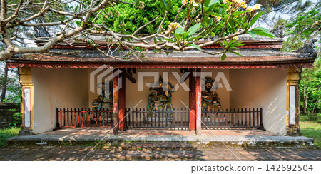Guardian deity statues in a traditional temple pavilion at Thien Mu Pagoda in Hue Vietnam 142692504