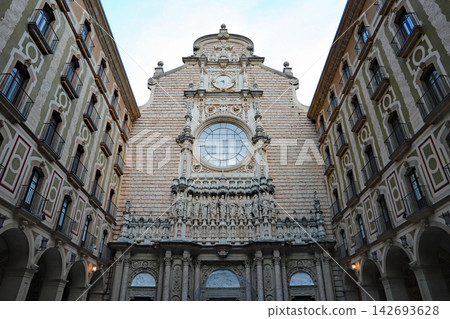 Exterior view of the Montserrat Cathedral, a Christian pilgrimage site in Catalonia, Spain. Exterior view of the Montserrat Cathedral, a Christian pilgrimage site in Catalonia, Spain. 142693628