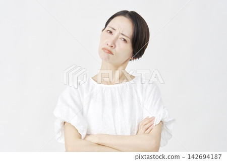 Middle-aged woman, angry, white background. Middle-aged woman, angry, white background. 142694187