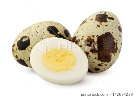 Boiled quail eggs and a peeled half close-up on a white background. Isolated Boiled quail eggs and a peeled half close-up on a white background. Isolated 142694289