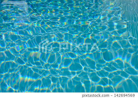 blue blurred textured swimming pool water surface waving motion by wind blow at noon sunshine blue blurred textured swimming pool water surface waving motion by wind blow at noon sunshine 142694569