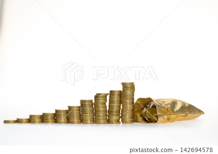 old & used gold coins stack up with small golden purse in white background old & used gold coins stack up with small golden purse in white background 142694578