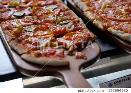 home made ellipse pan pizza on served home made ellipse pan pizza on served 142694580