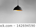 vintage style hanged ceiling lamp warm orange tone light color bulb light with dark tone dirty concrete background wall 142694590